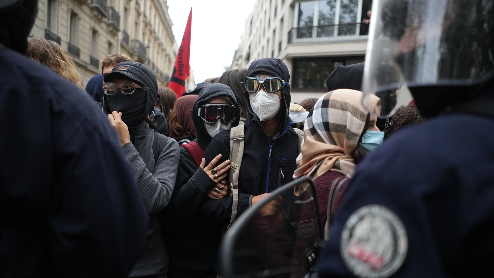 Police fire tear gas at a barricaded high school in Paris as school protests show no sign of ending