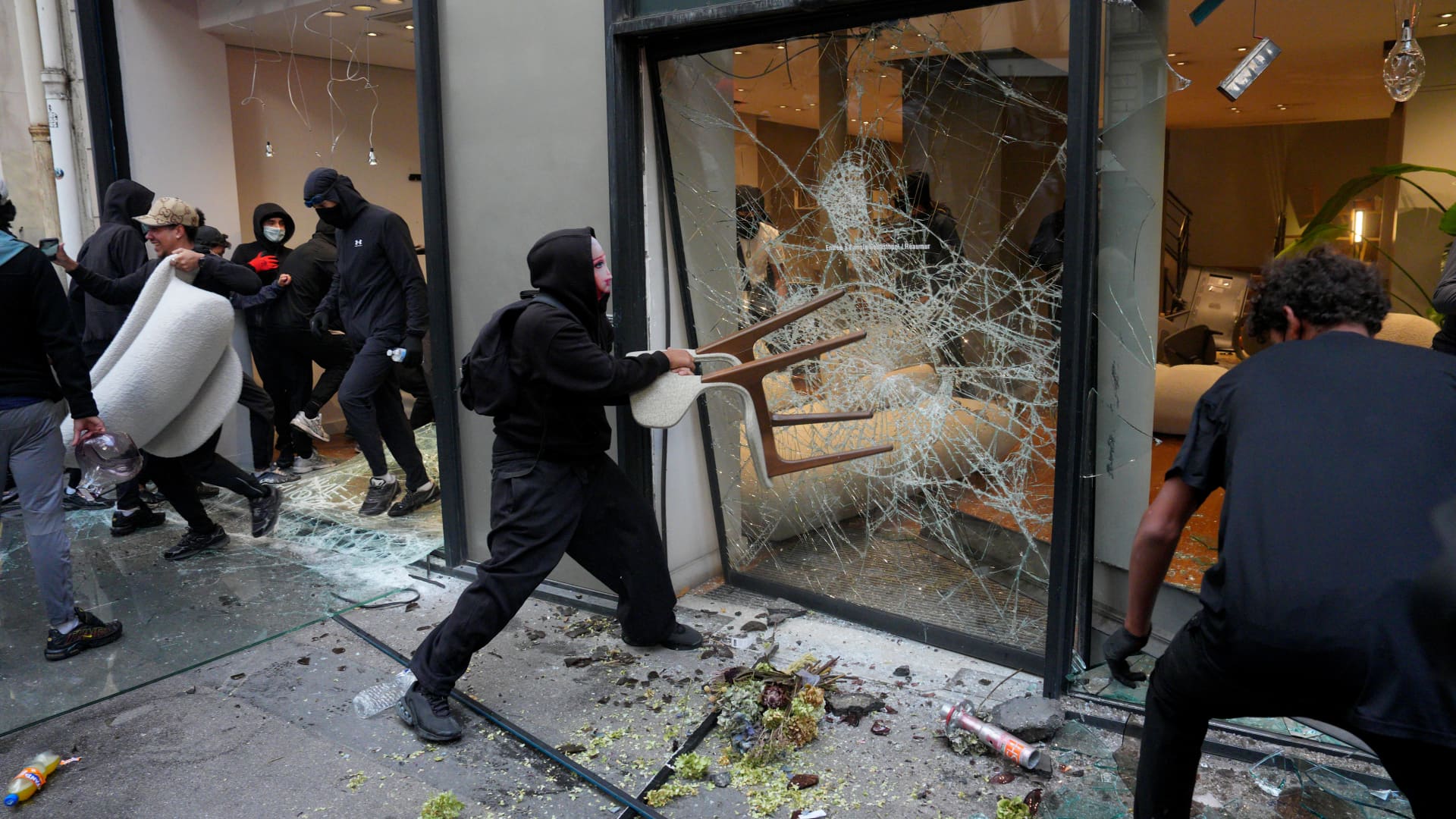 France curfews calm unrest as Macron faces criticism over Gulf trip