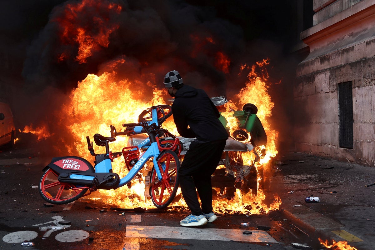 France protests live: Curfews issued as Trump tries to exploit riots for midterm gain