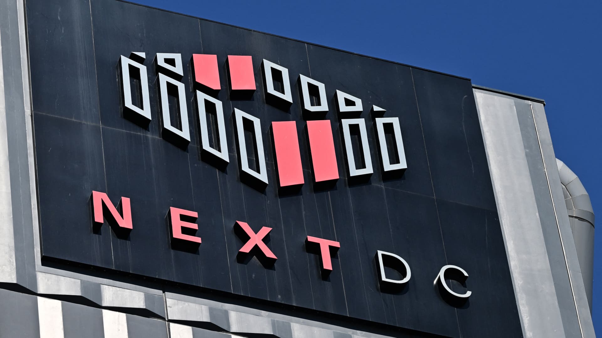 Australian data center operator NextDC's shares plunge 40% after it slashes earnings forecast