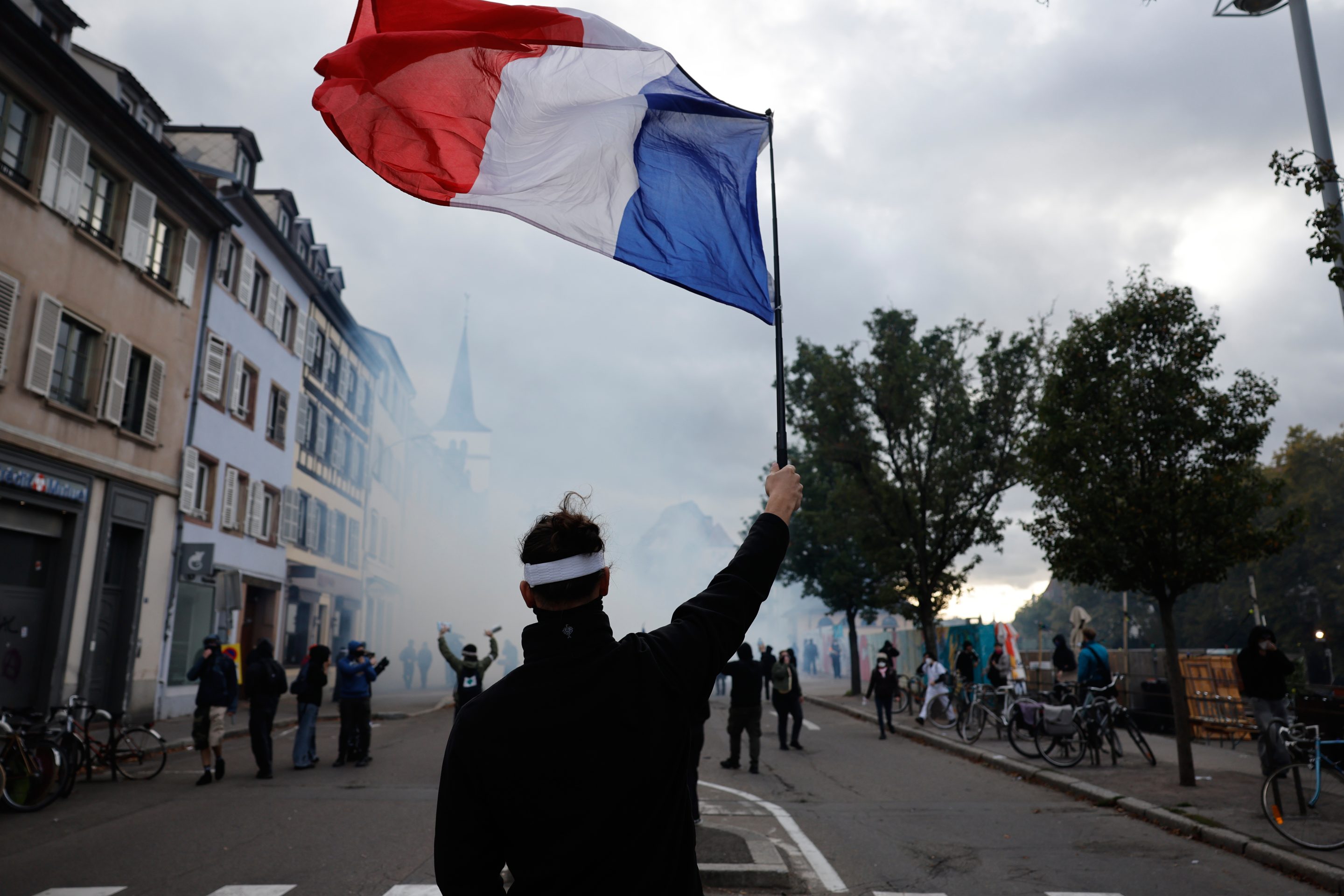 French police use tear gas and water cannons after some protests turn violent