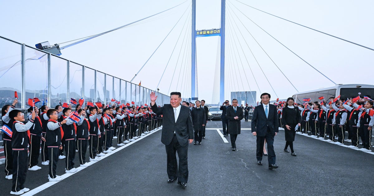 North Korea's Kim Jong Un touts ties, opens bridge with China on first trip in a year