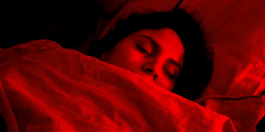 Your phone’s blue glow is keeping you up. Could red light be the fix?